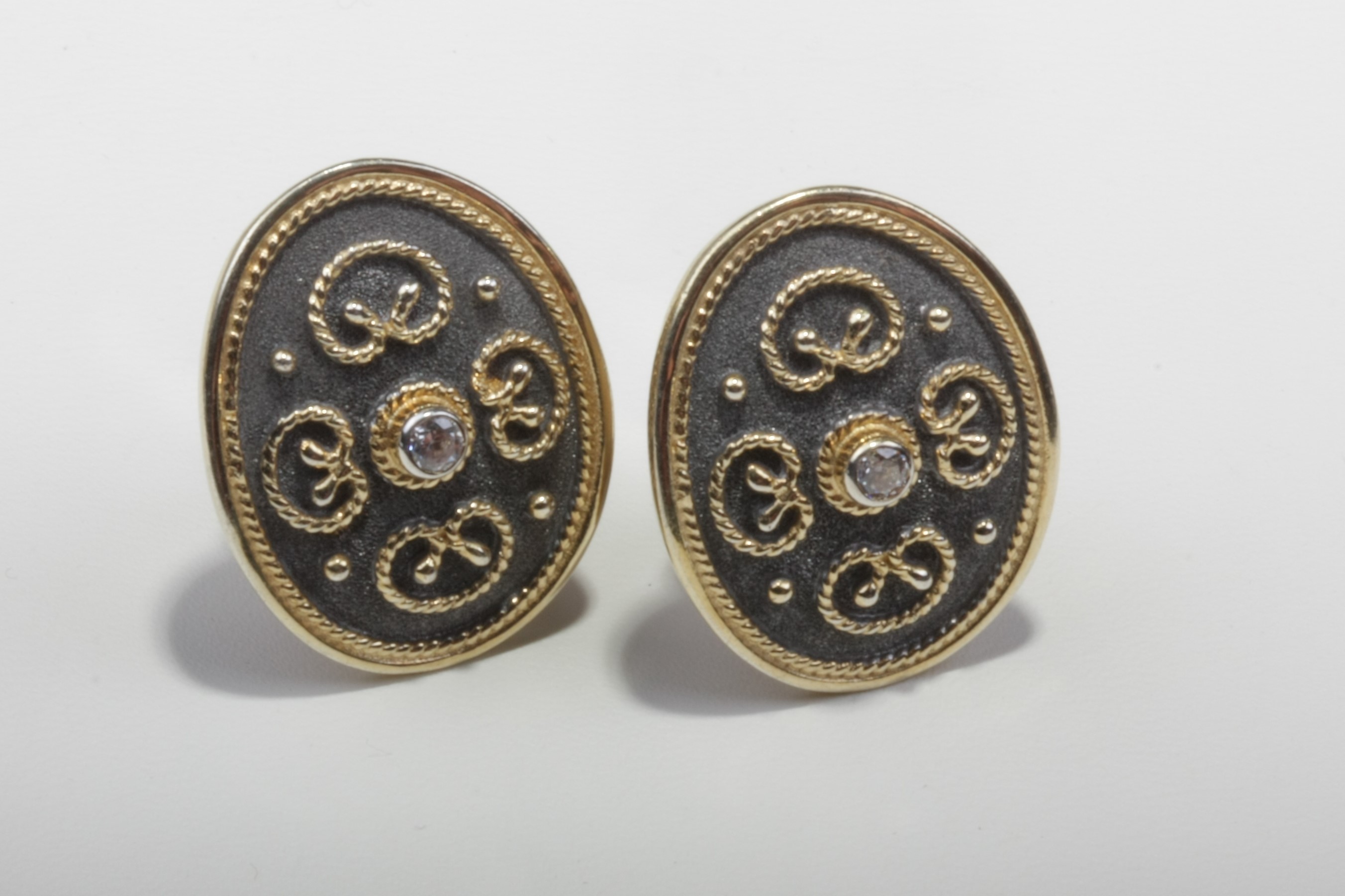 dark gold tone silver earrings mg