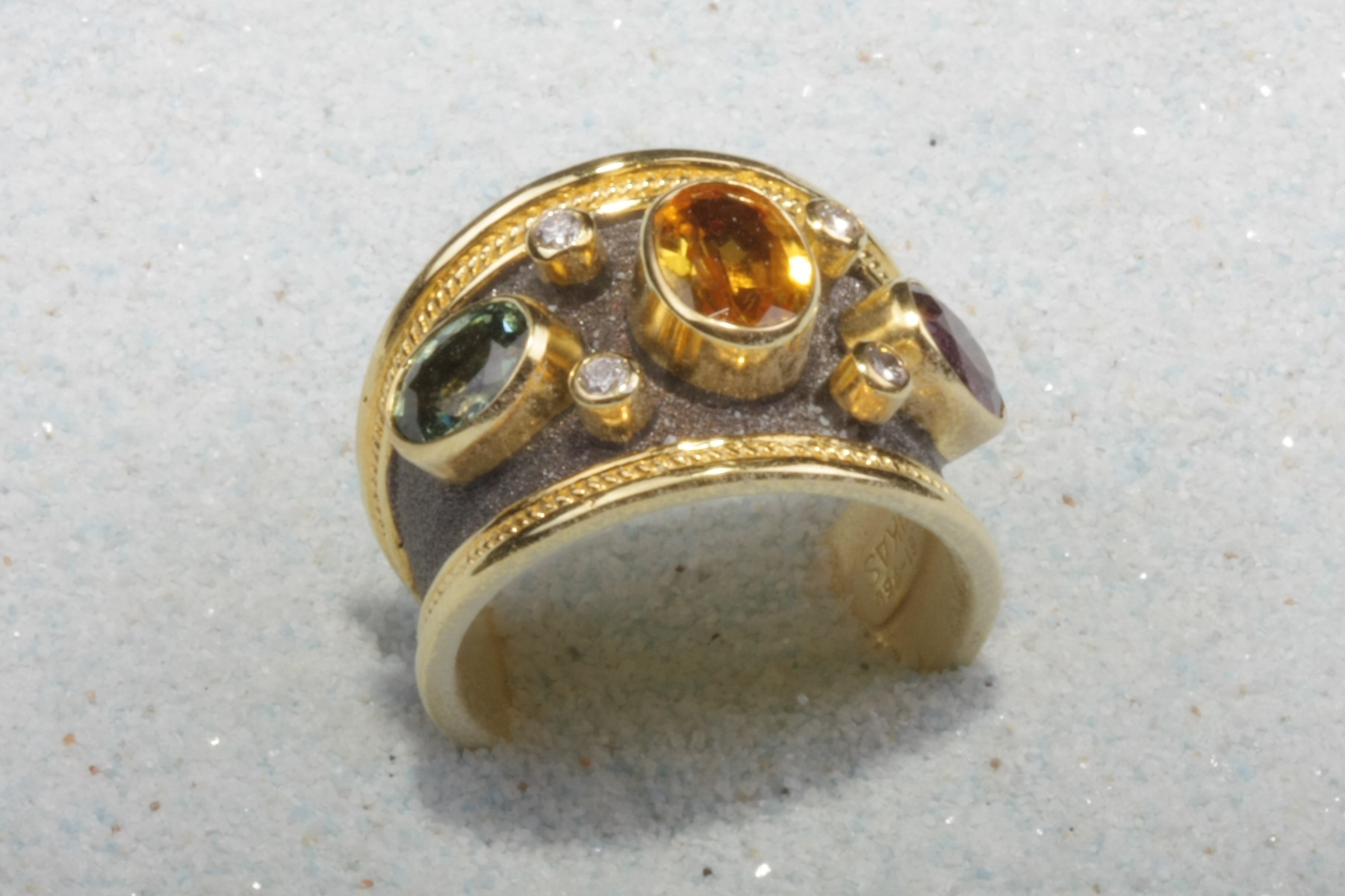 dark gold tone silver ring three stone