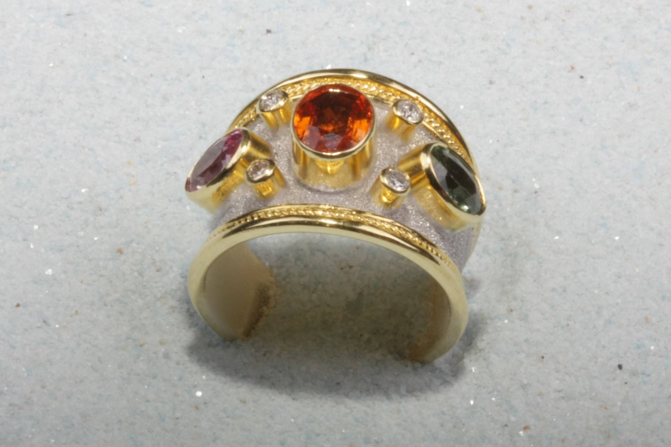 light gold tone silver ring three stones