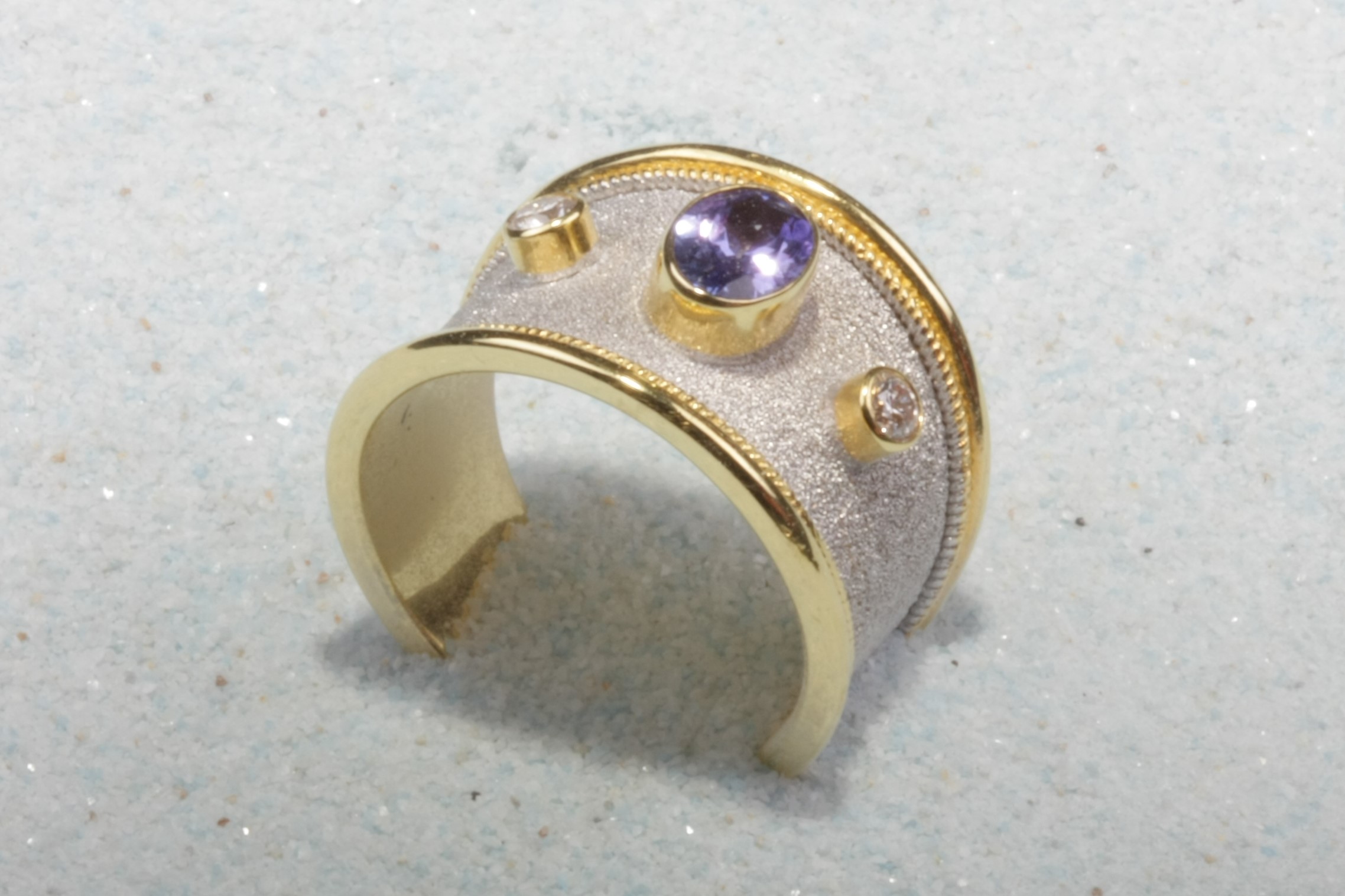 ligth gold tone silver ring purple stones